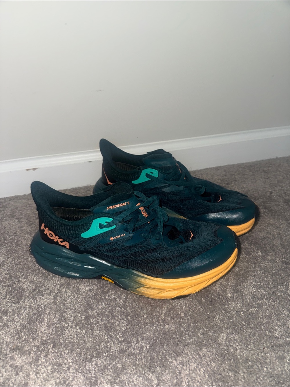 Hoka Speedgoat 5 Sneakers in Dark Teal with Teal Accents and Yellow